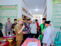 Bupati Gusnan Lantik PAW Kades Desa Suka Bandung